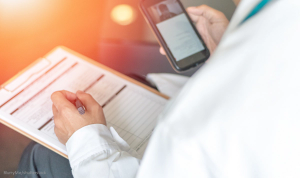 Doctor holding smartphone