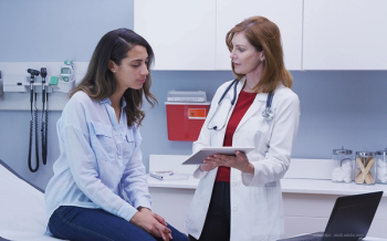 Female patient with doctor