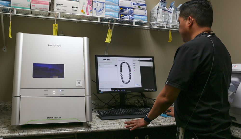 Eric Mayuga, DDS, setting up a case for milling with his DWX-42W.