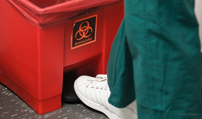 Opening a biohazard waste basket