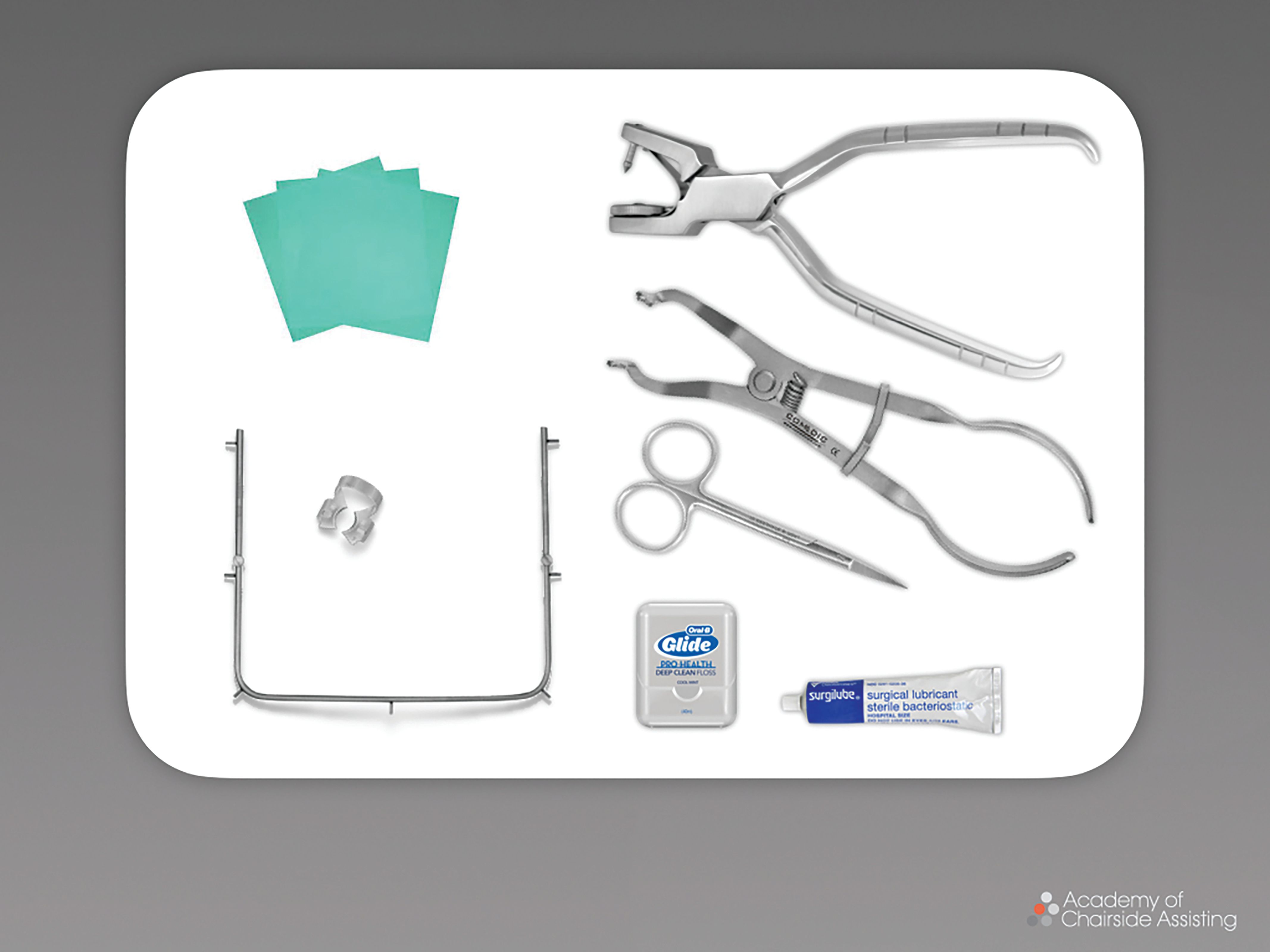 Figure 1. The procedure requires a variety of supplies, such as clamps and forceps, a dental punch, and a frame.