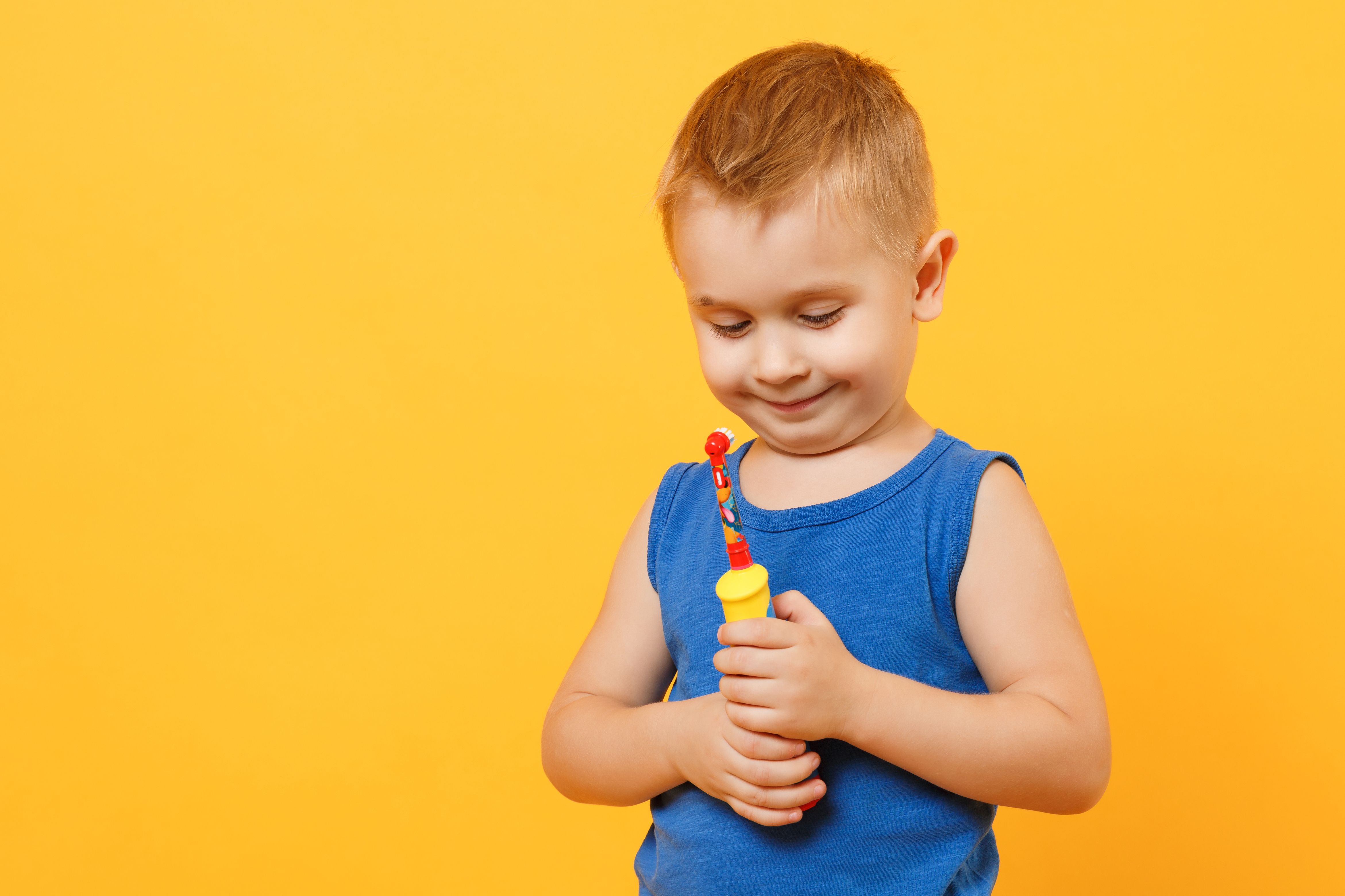 child with a toothbrush