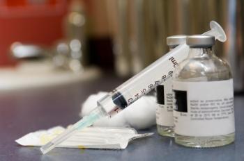 syringe and vials of injectable medication