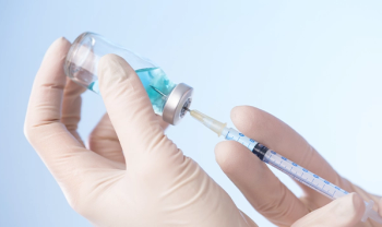 doctor filling injection vial