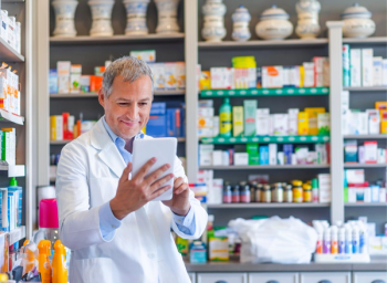 pharmacist with iPad