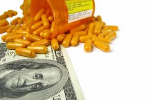 medication bottle and money