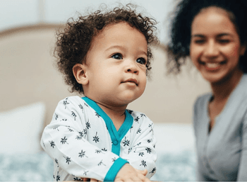 Close up image of baby and mother