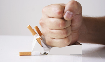 Hand crushing cigarettes
