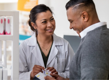 Pharmacist discusses medication with patient