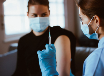 pharmacist with vaccine