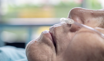 elderly patient lying down with breathing tube