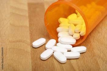 Orange pill bottle with white pills | Image Credit: Matthew Benoit - stock.adobe.com