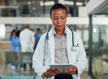 hospital pharmacist reading news