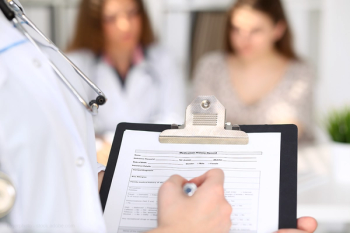 physician filling out paperwork