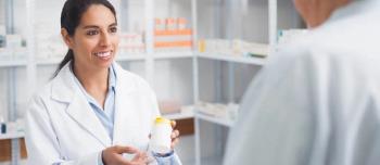 Pharmacist with patient