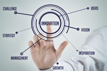 touchscreen display with hand hovering over the word innovation