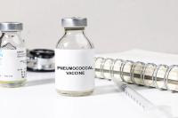 Pneumococcal vaccine bottle on a desk | Image credit: Kamitana - stock.adobe.com
