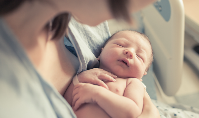 mother holding newborn