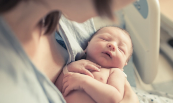 mother holding newborn