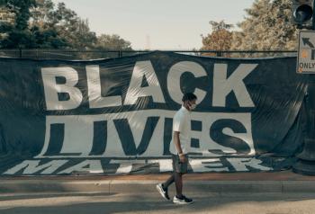 Black lives matter with man wearing mask