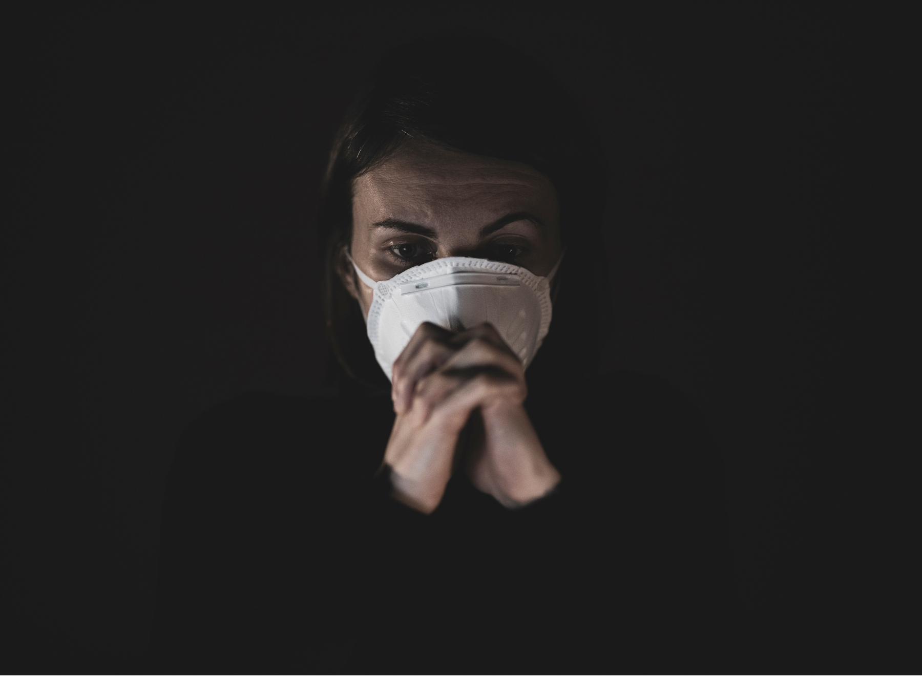Woman stands with mask