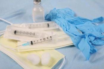 vaccines on table with mask