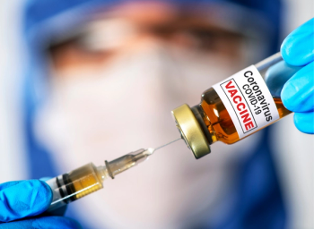 pharmacist administering COVID-19 vaccine