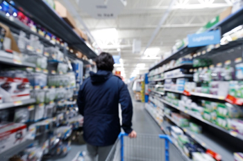 customer walking down shopping isle