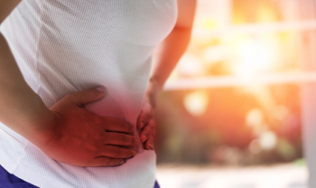 patient holding stomach