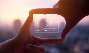 hands surrounding video icon