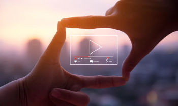 hands surrounding video icon