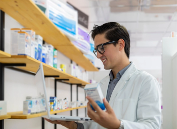 pharmacist working with laptop