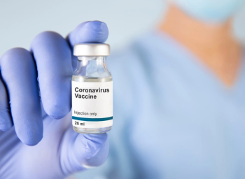 pharmacist holding COVID-19 vaccine