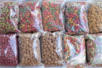 Bags of dog kibble stored in plastic bags