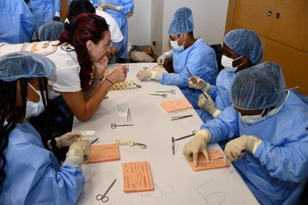 Students practice surgical suturing. (Photo Courtesy of the North American Veterinary Community)