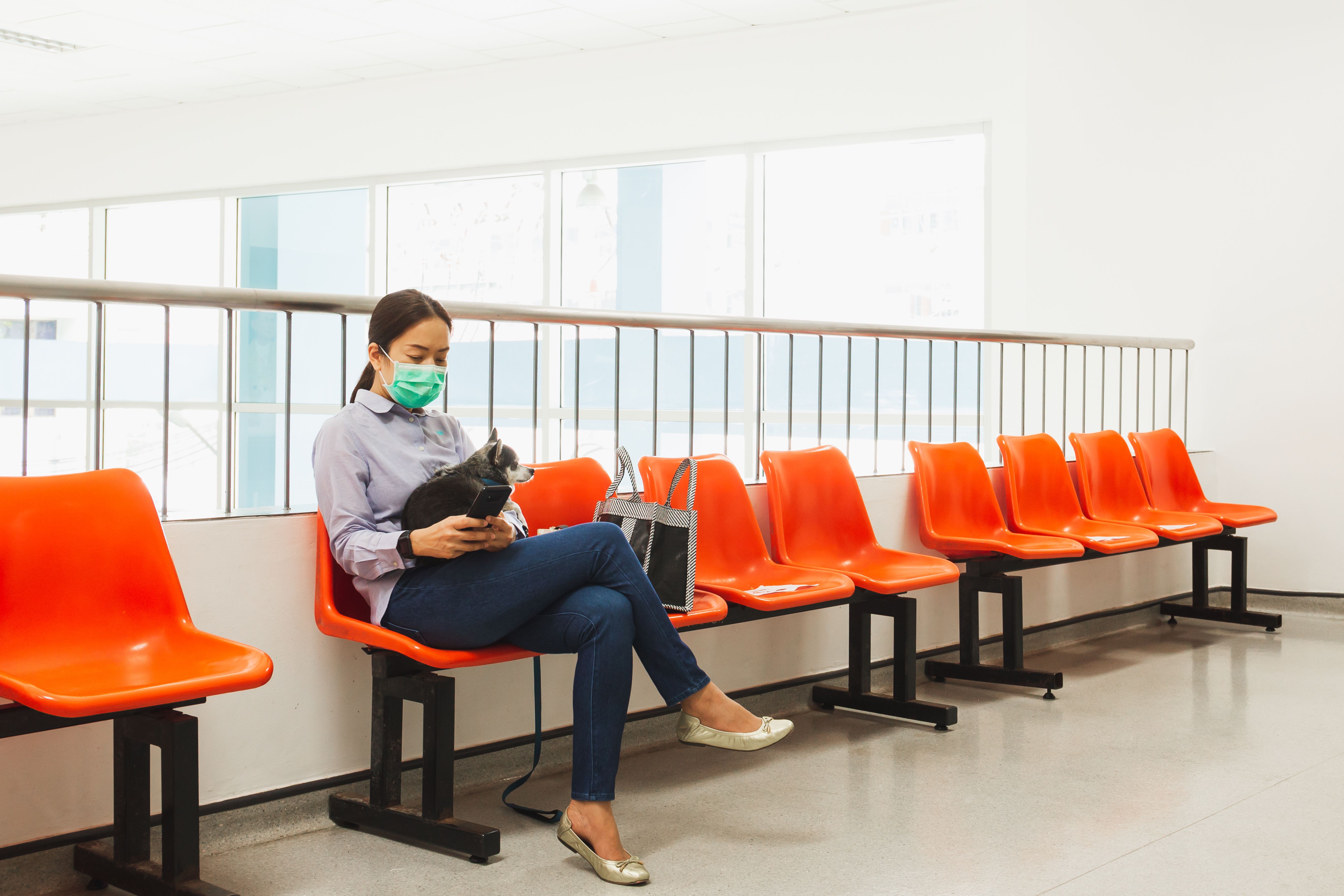 By Bignai Woman Sitting with Her Pet Wearing a Mask 