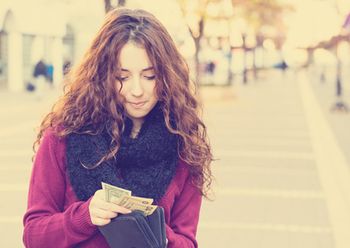 veterinary-woman-young-wallet-money-dollars-450px-498454082.jpg