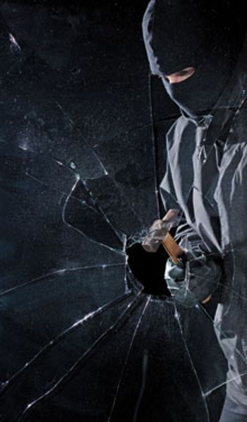 A-criminal-breaking-into-a-window-with-a-hammer_220_110054955.jpg