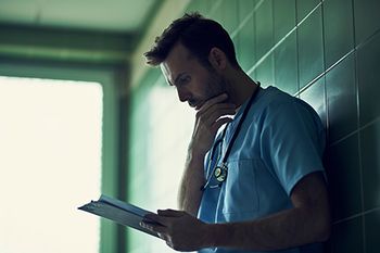 veterinary-man-nurse-reading-chart_AdobeStock_150178525-450.jpg