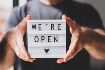 "We're Open" sign