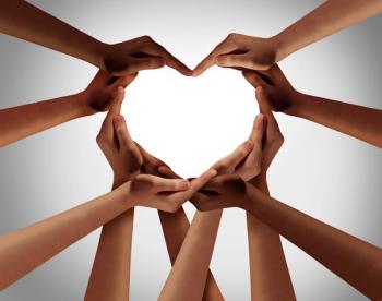 hands from all cultures making a heart