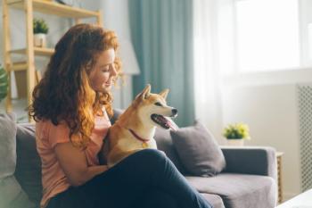 happy woman with pet dog