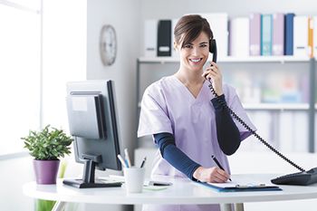 veterinary-young-practitioner-doctor-working-at-the-clinic-reception-desk-450px-shutterstock-505757569.jpg