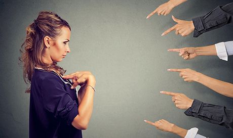 pointing fingers at woman