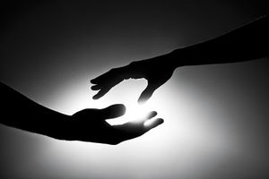 veterinary-black-and-white-image-of-two-hands-reaching-out-168623617-450px.jpg
