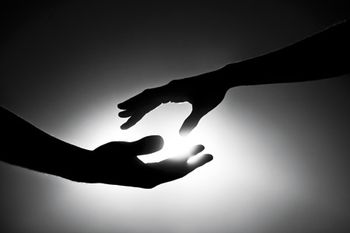 veterinary-black-and-white-image-of-two-hands-reaching-out-168623617-450px.jpg