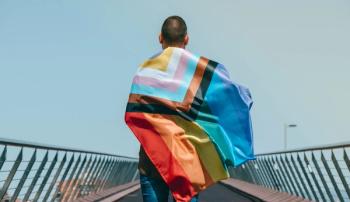 man wearing pride flag