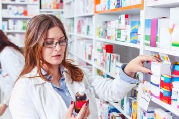 pharmacologist checking prescriptions