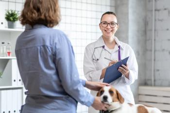 veterinarian with client