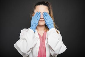 veterinary-doctor-covering-eyes-450px-shutterstock-775247044.jpg
